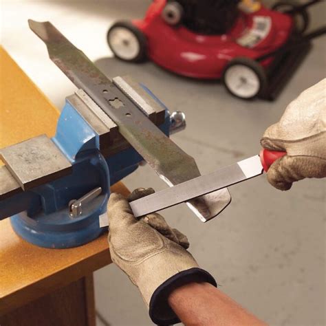 Move the sharpener up and down the length of the blade edge. Once one side is sharpened without any rough spots or nicks, flip the blade over, secure it in the vice, and sharpen using the same procedure. Sharpen with an angle grinder or bench grinder. Hold the angle grinder perpendicular to the edge of the blade.
